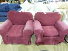 A pair of claret coloured single armchai