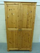 A pine two door wardrobe (W96cm x D54cm