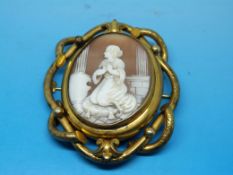 A yellow metal and carved shell cameo br