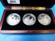 A Queen Mother 80 Years three-coin cased