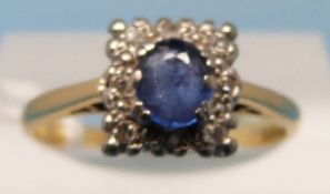 A yellow metal ring set with a sapphire