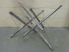 A modern chrome and wire sculpture or ta