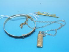 A 9ct gold ingot pendant on 9ct gold cha