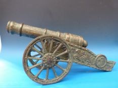 A cast metal cannon with decoration in r