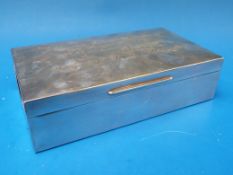 A hallmarked silver cigarette box with i