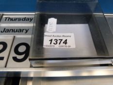 A vintage aluminium desk tidy with calen