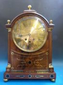 A large bracket clock with three train w