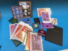 Seventeen cased or framed UK coin sets l