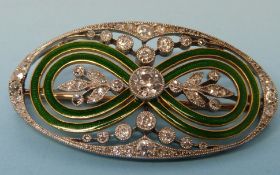 An Edwardian platinum and gold oval broo