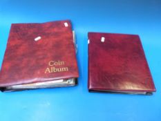 A burgundy red coin album containing an