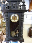 A Vienna regulator style wall clock