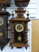A Vienna regulator style wall clock with