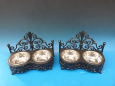 Two ornate dog or cat feeding stations w