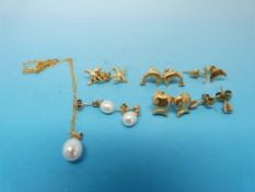 Four pairs of yellow metal earrings mark