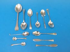 A collection of silver spoons including