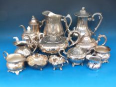 A quantity of plated teapots, jugs etc