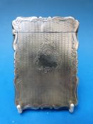 A hallmarked silver card case with shape