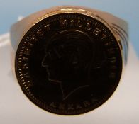 A yellow metal ring set with a 22ct gold