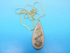 A lava pendant carved with a lady on a y