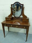 A mahogany inlaid dressing table with sh
