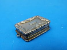 A hallmarked silver gilt vinaigrette wit