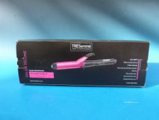 A boxed TRESemmé Salon Volume Curling to