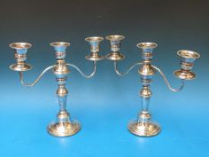 A pair of hallmarked silver three branch
