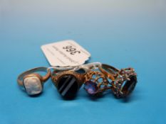 Four 9ct gold rings, one set with an ame