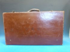 A vintage brown leather suitcase