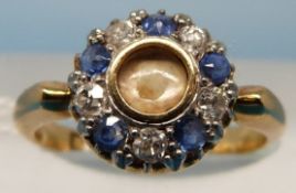 A yellow metal ring marked 18ct gold set