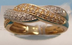 A 14ct gold ring set with diamonds in a