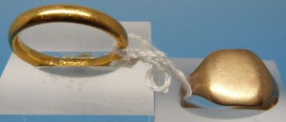 A 22ct gold wedding band (5.7g) and a 9c