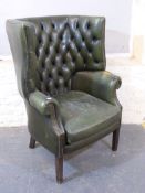 WITHDRAWN A pair of leather tub chairs a