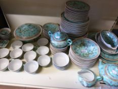 A 12-place setting Oriental style turquo