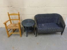 A child's wicker two seat sofa and match