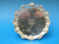 A hallmarked silver salver with shaped e