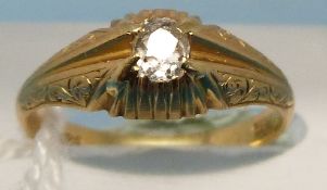 An 18ct gold ring set with a diamond sol