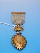 A yellow metal Masonic Queen Victoria Go