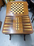 A 19thC walnut foldover games table with