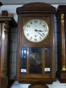 A rectangular wall clock with three trai