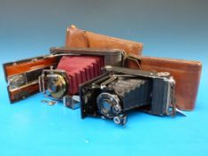 A Kodak folding bellows camera in leathe