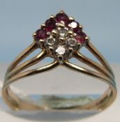 A hallmarked 9ct gold ring set with rubi