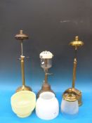 Three decorative brass lamps including a
