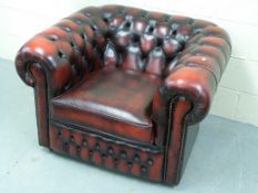 A leather Chesterfield club armchair