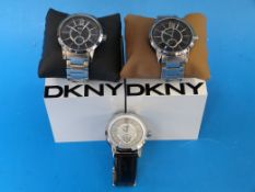 Three DKNY wristwatches, one on leather