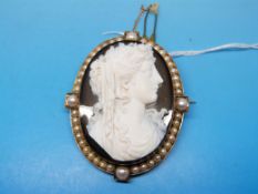 An agate cameo of a lady in yellow metal