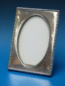 A hallmarked silver photograph frame, he