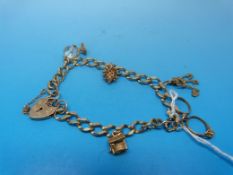 A yellow metal charm bracelet marked 9ct