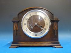 An oak-cased mantel clock with German mo