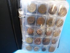 A booklet containing an amateur coin col